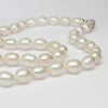 white barrel pearl necklace with silver clasp