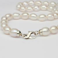 white barrel pearl necklace with silver clasp
