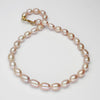 Pink barrel pearl necklace with silver gold plated clasp