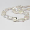 White oval coin pearl necklace with silver magnetic clasp