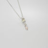 Silver long twizzle pendant with pink pearl by Suzie Horan