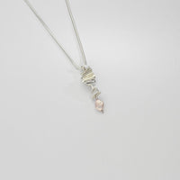 Silver long twizzle pendant with pink pearl by Suzie Horan