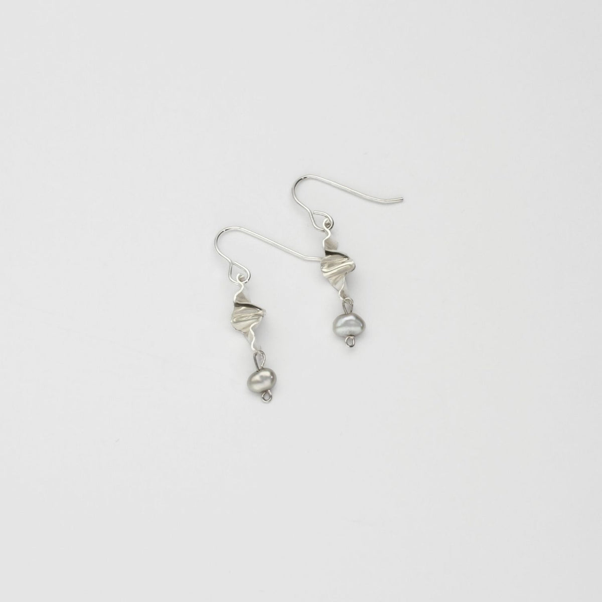 Silver small twizzle earrings with grey pearls by Suzie Horan