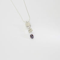 Long twizzle pendant with peacock pearl by Suzie Horan