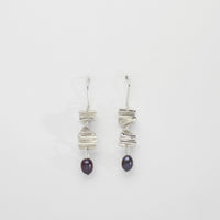 Long twizzle earrings with peacock pearls by Suzie Horan