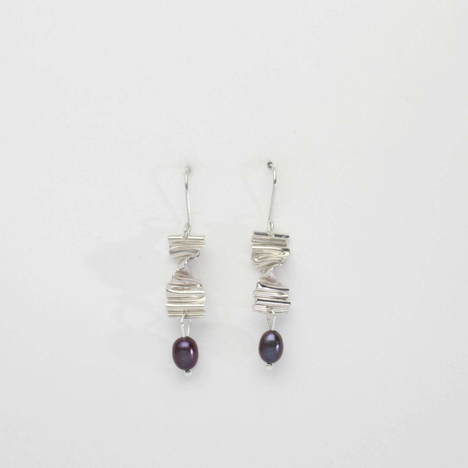 Long twizzle earrings with peacock pearls by Suzie Horan