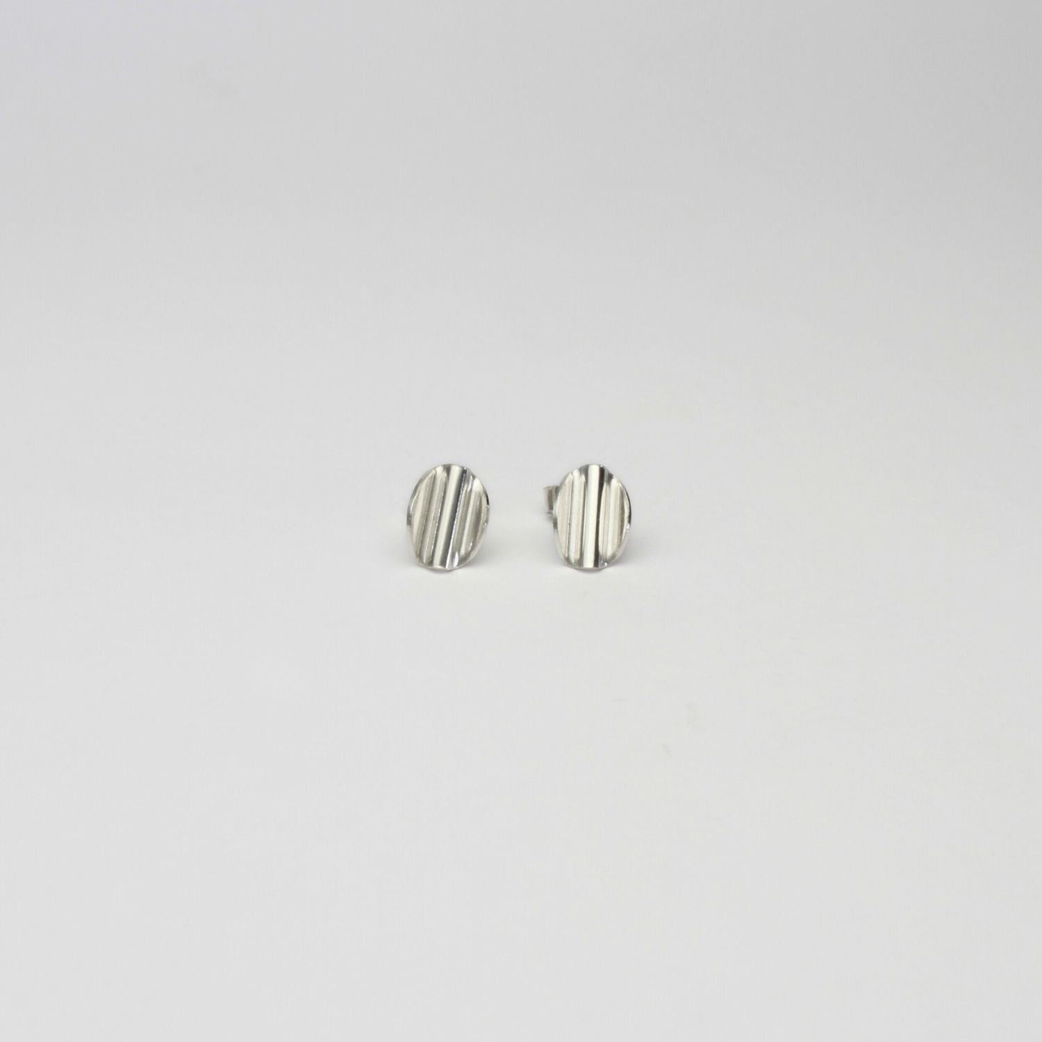 Medium oval ripple silver earrings by Suzie Horan