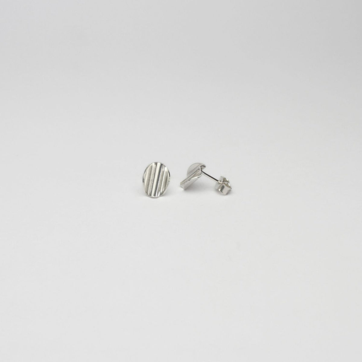 Medium oval ripple silver earrings by Suzie Horan
