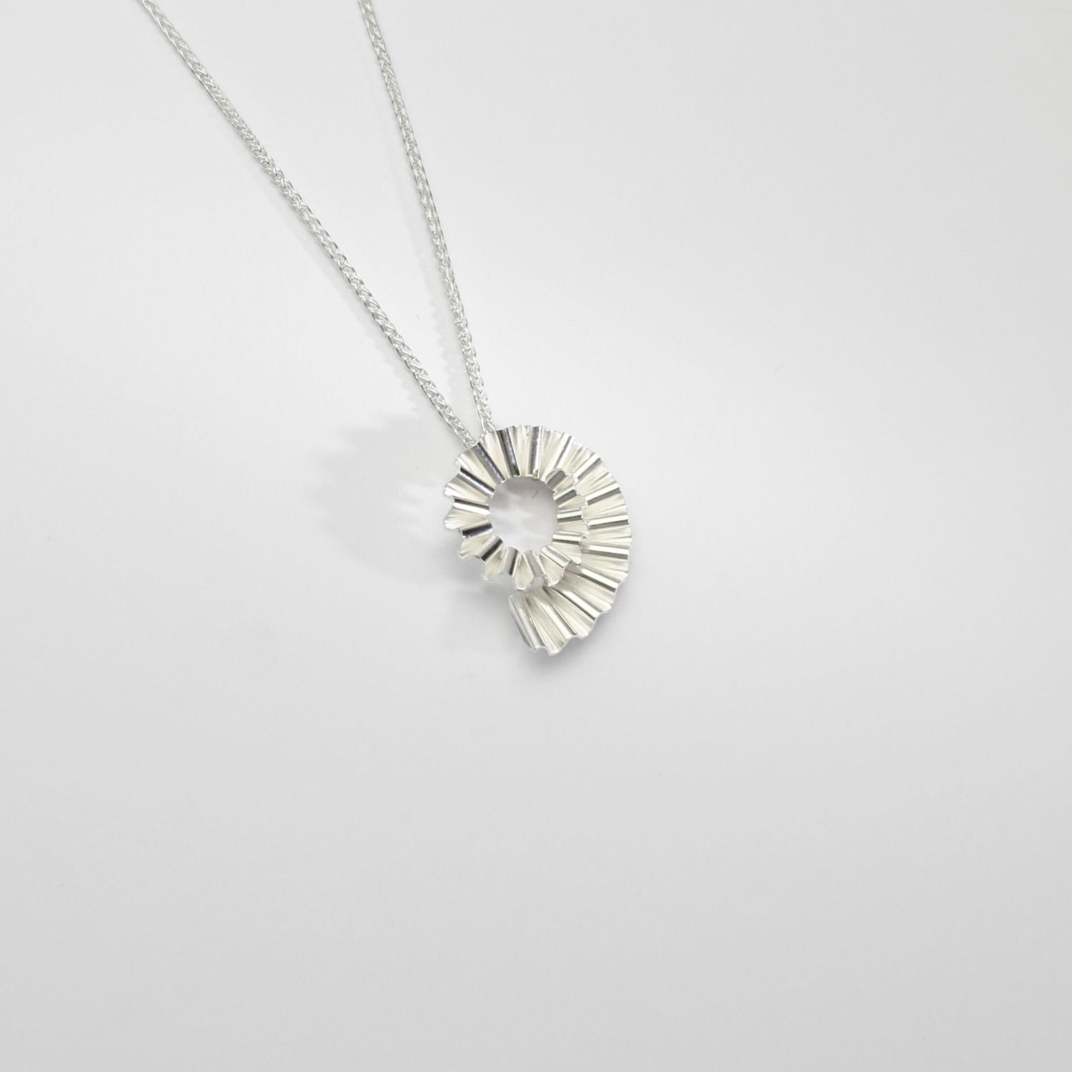 Small silver ammonite pendant by Suzie Horan