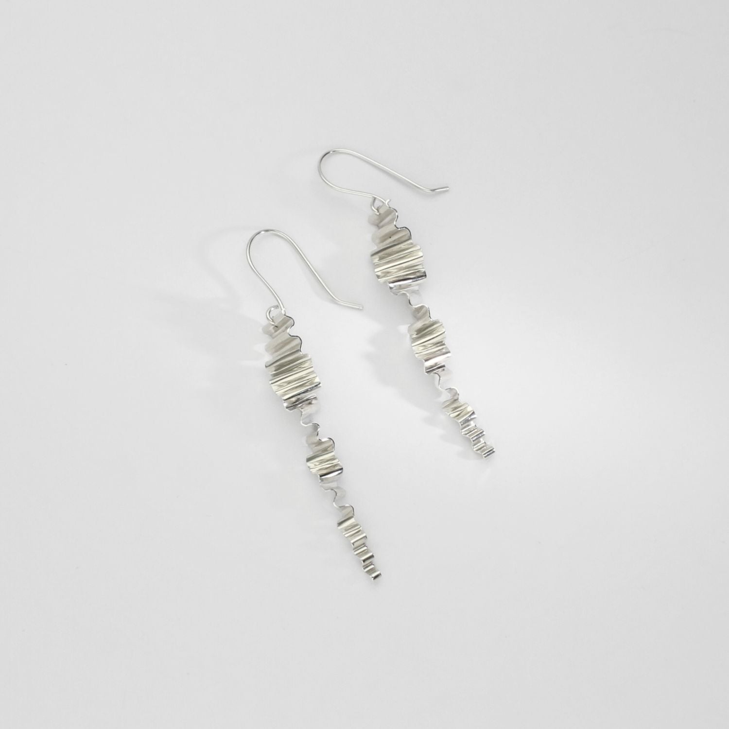 Silver long ripple twist earrings by Suzie Horan