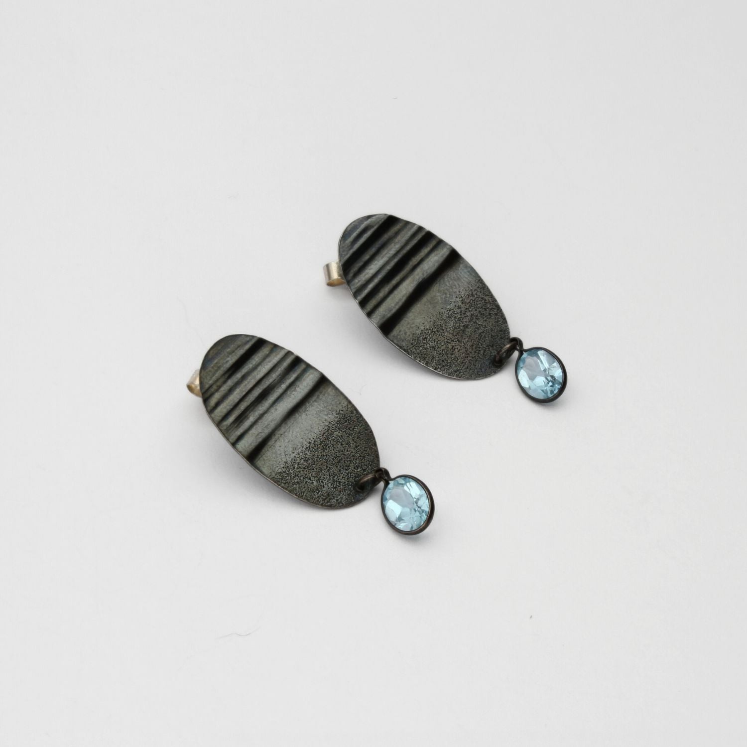 Black silver drop earrings with blue topaz by Suzie Horan