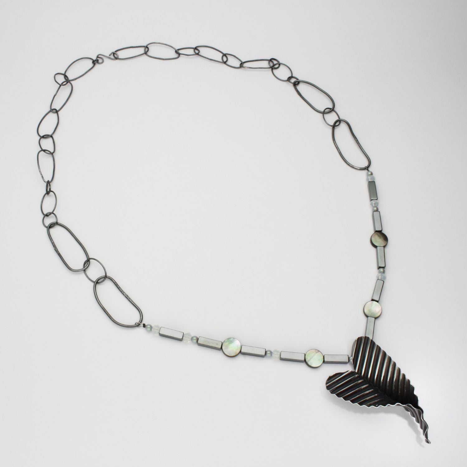 Large ripple heart necklace with opalite and hematite black silver by Suzie Horan