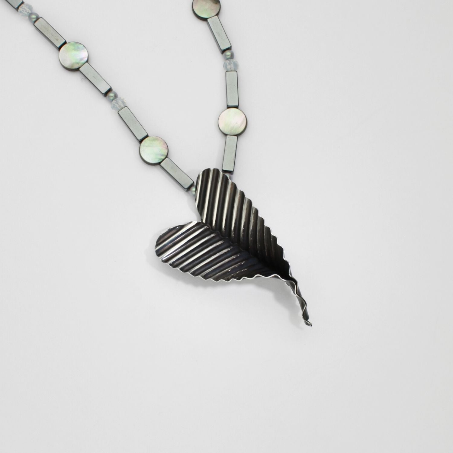 Large ripple heart necklace with opalite and hematite black silver by Suzie Horan