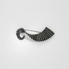 Wave brooch black silver by Suzie Horan