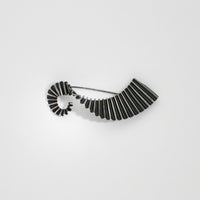 Wave brooch black silver by Suzie Horan