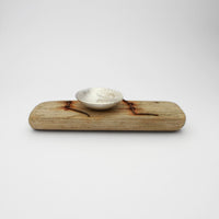 Silver ammonite bowl on small driftwood with nails by Suzie Horan