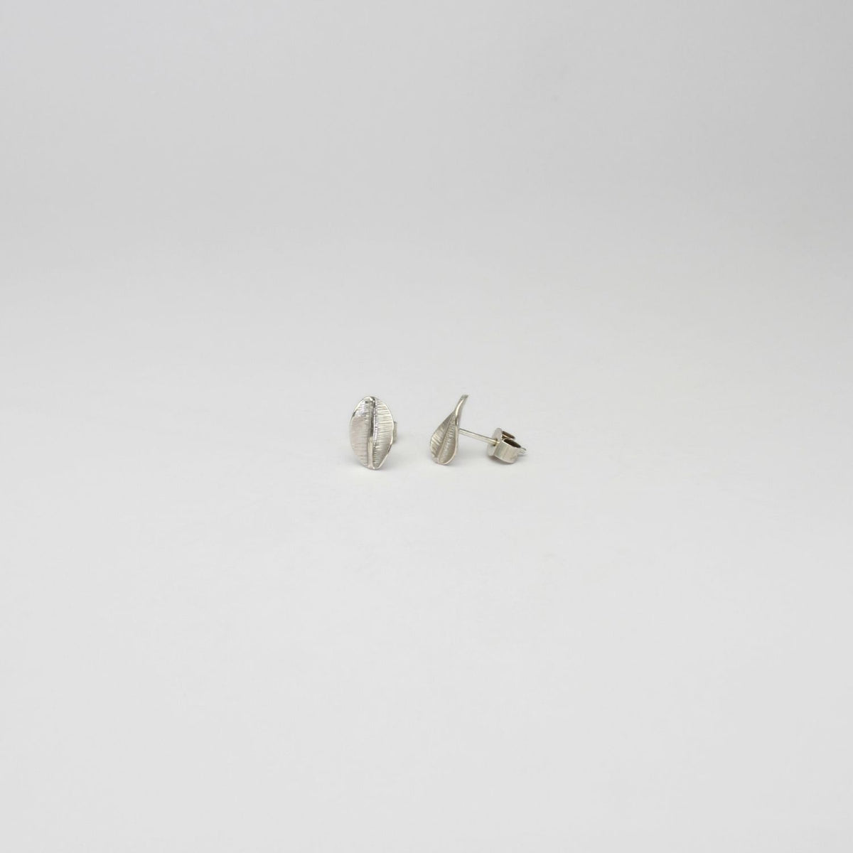 Spring leaf extra-small silver studs by Yelland & Barker