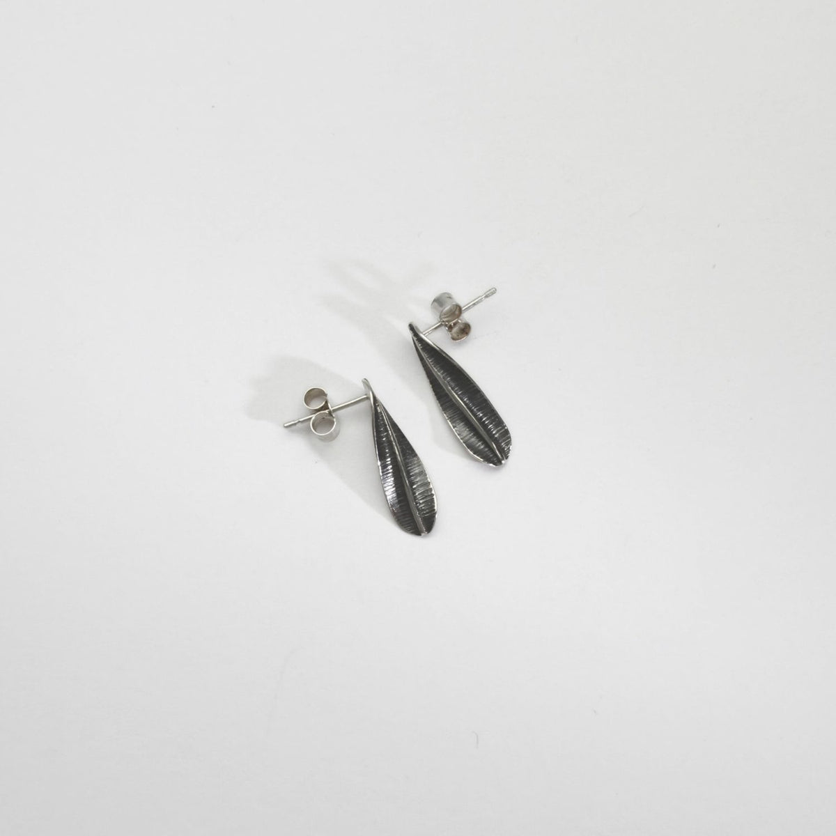 Spring leaf small black silver studs by Yelland & Barker