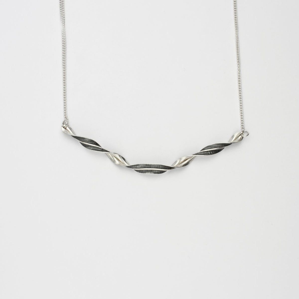 Spring leaf ribbon twist black silver necklace by Yelland & Barker