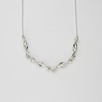 Spring leaf small twist silver necklace by Yelland and Barker
