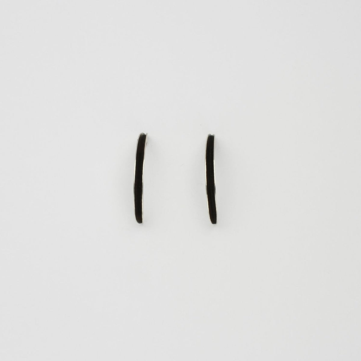Willow leaf curl earrings in silver by Yelland and Barker