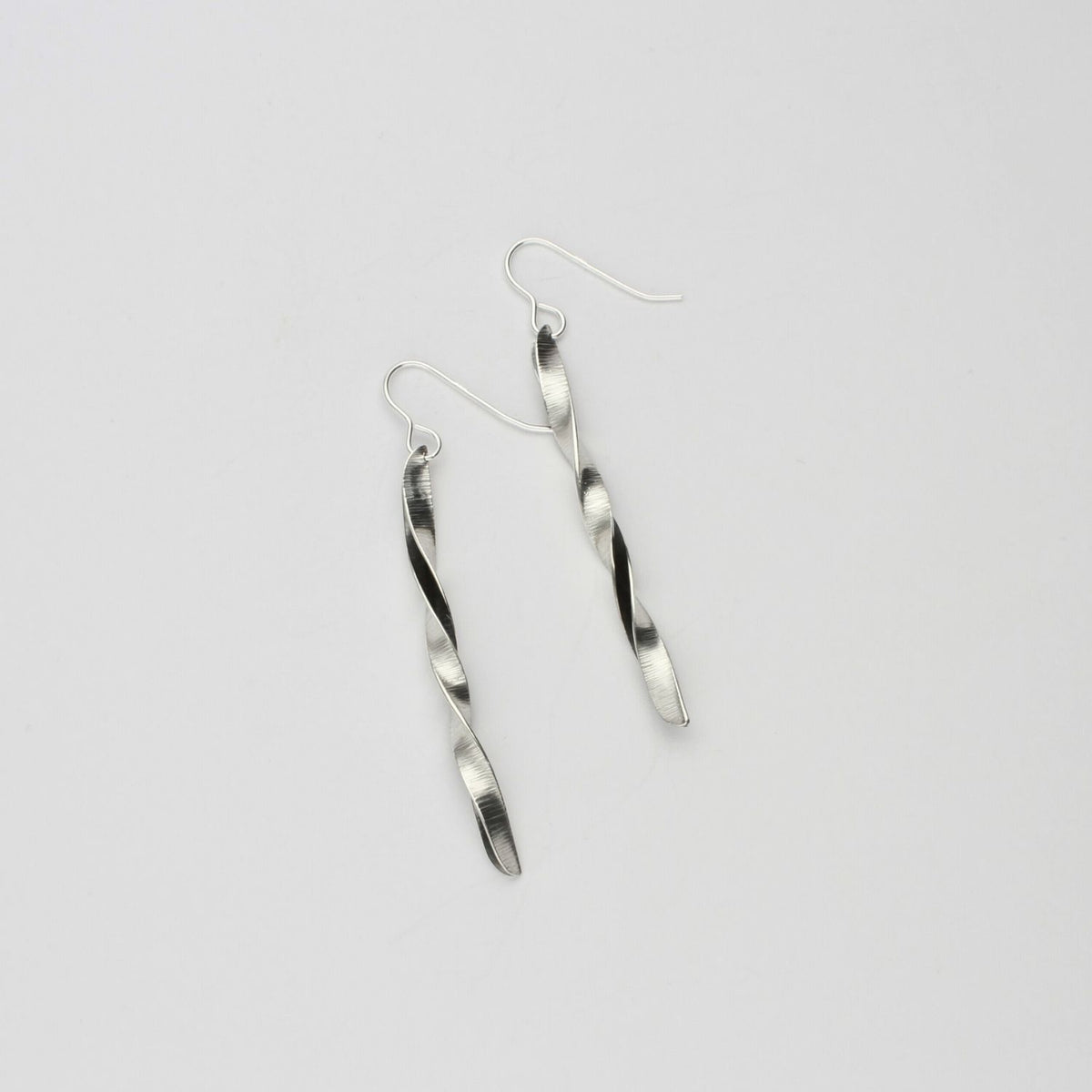 Willow leaf slimeline full twist silver earrings by Yelland and Barker