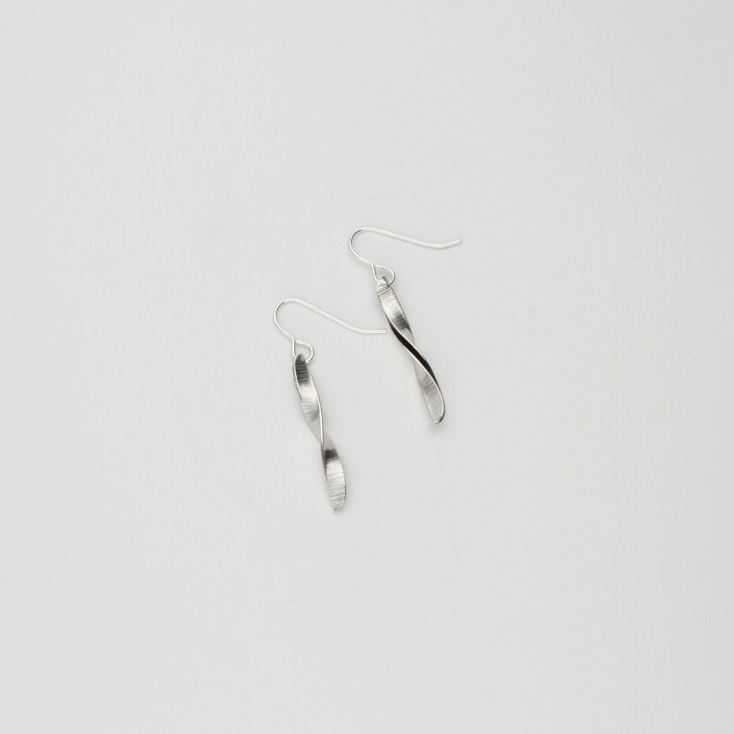 Willow leaf slimeline half twist silver earrings by Yelland and Barker