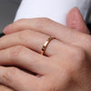 Welsh gold ring inspired by the strata of Welsh slate handcrafted and handmade in 18ct rose red gold. shown worn on model 