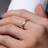 Welsh gold ring inspired by the strata of Welsh slate handcrafted and handmade in 18ct rose red gold. shown worn on model 