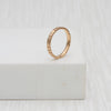 Welsh gold ring inspired by the strata of Welsh slate handcrafted and handmade in 18ct rose red gold 