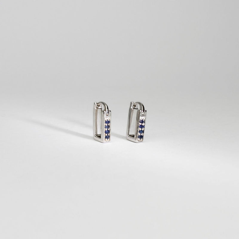 Rectangular silver hoop earrings with sapphires by Yuki Mitsuyasu