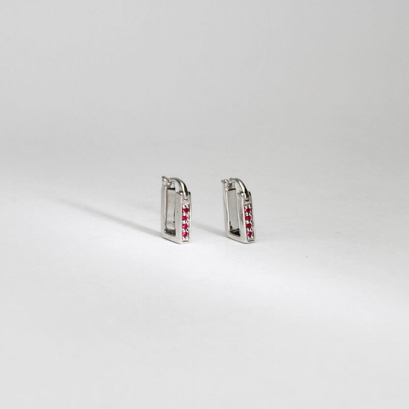 Rectangular silver hoop earrings with rubies by Yuki Mitsuyasu