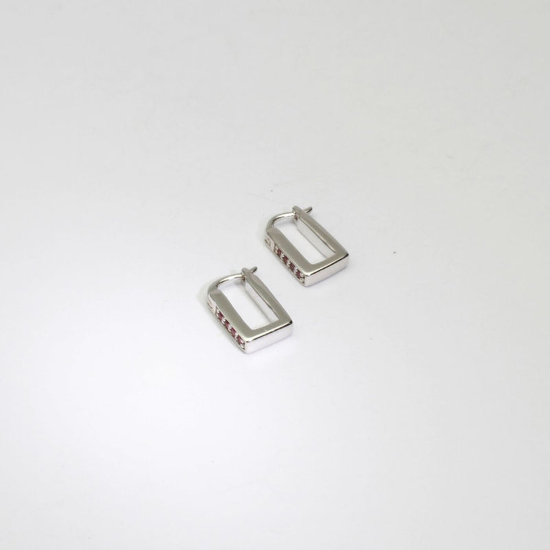 Rectangular silver hoop earrings with rubies by Yuki Mitsuyasu