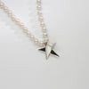 Big silver star on 30' pearl necklace by Yuki Mitsuyasu