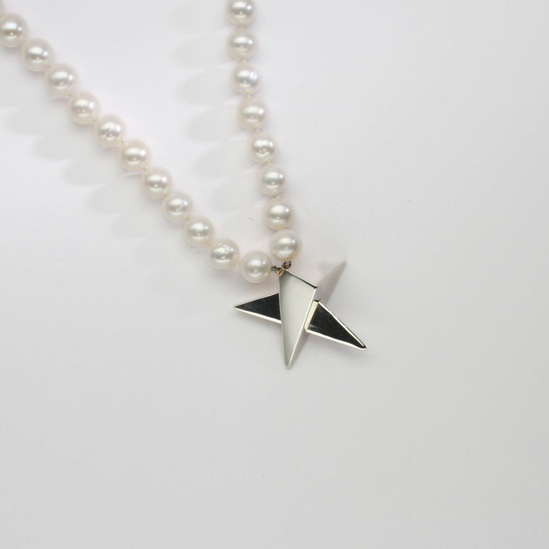 Big silver star on 30' pearl necklace by Yuki Mitsuyasu