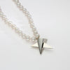 Big silver star on 30' pearl necklace by Yuki Mitsuyasu
