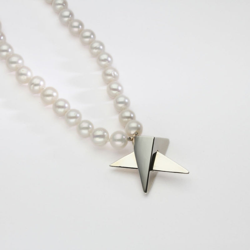 Big silver star on 30' pearl necklace by Yuki Mitsuyasu