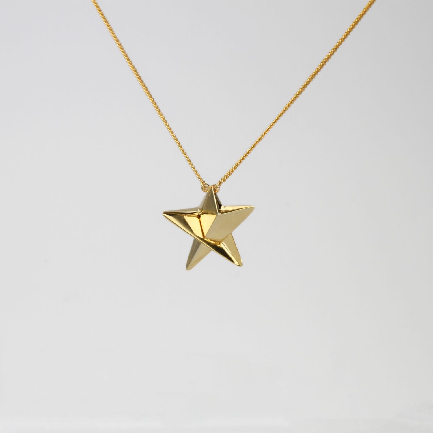 Small star necklace in 18ct gold plated silver by Yuki Mitsuyasu