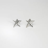 Star stud earrings in silver by Yuki Mitsuyasu