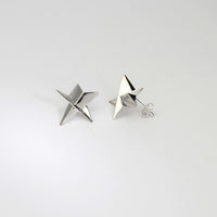 Star stud earrings in silver by Yuki Mitsuyasu