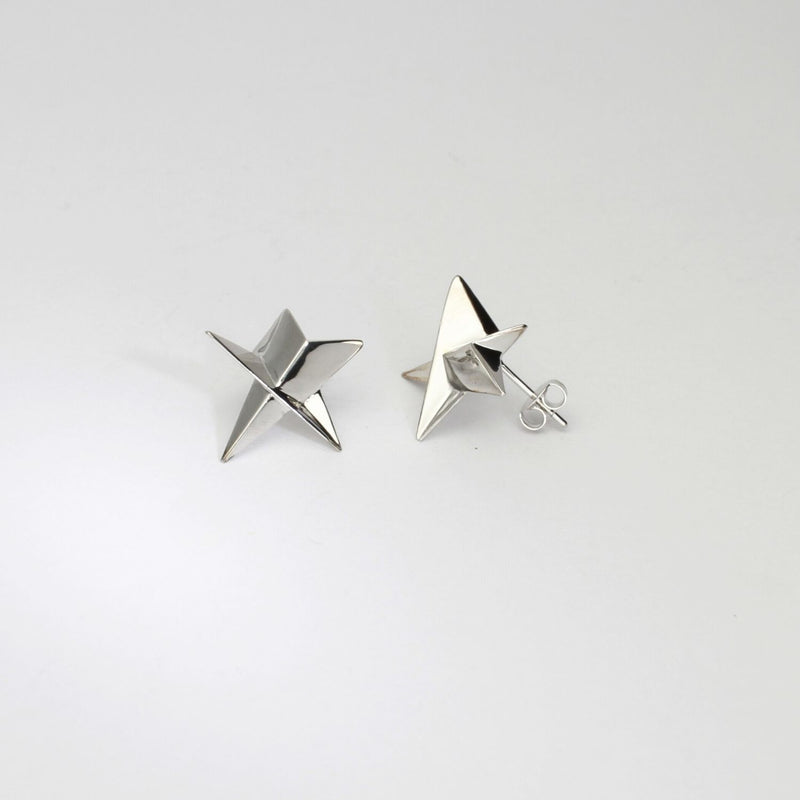 Star stud earrings in silver by Yuki Mitsuyasu