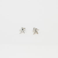 Mini silver star studs by Yuki Mitsuyasu