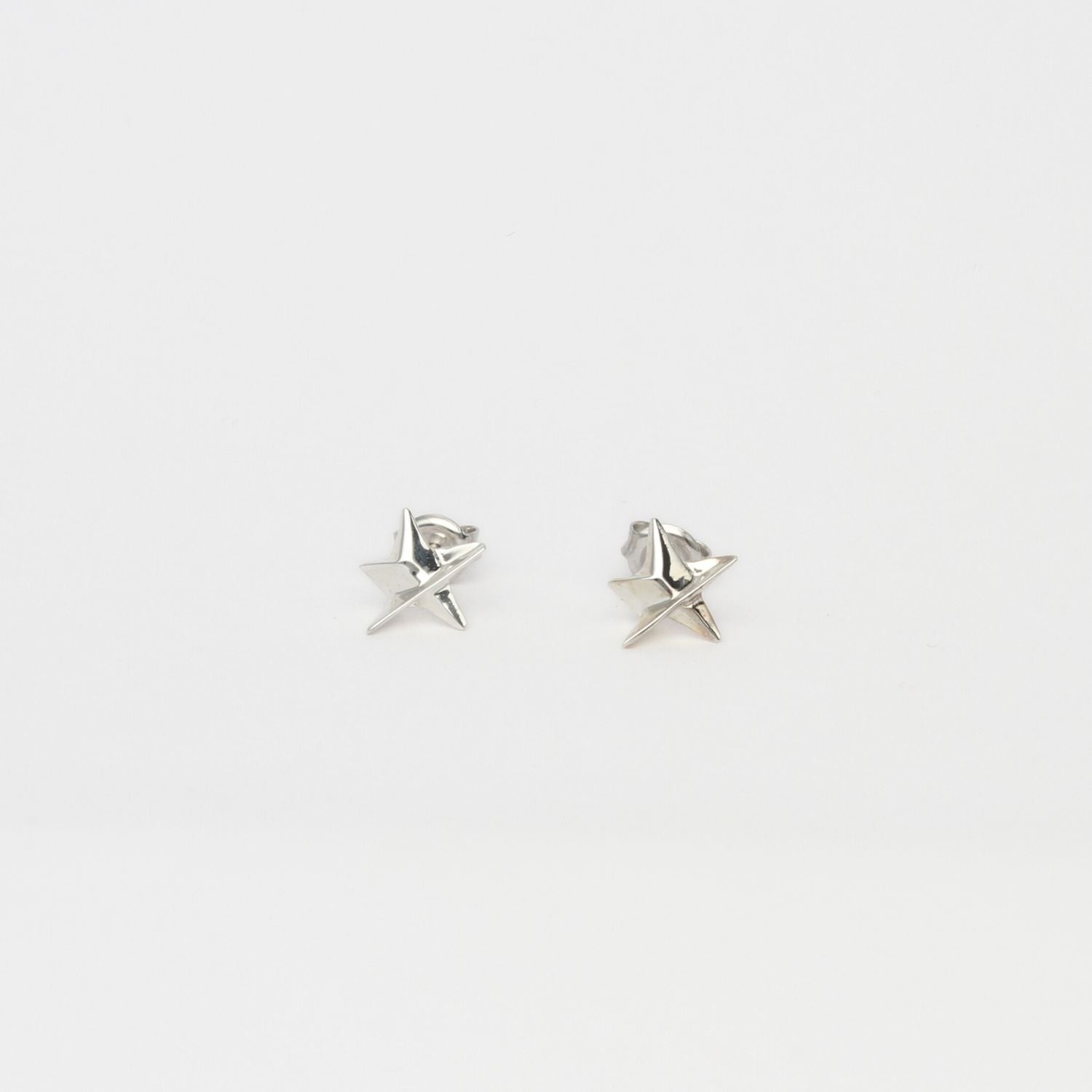 Mini silver star studs by Yuki Mitsuyasu