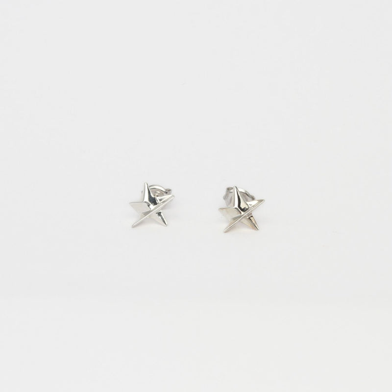 Mini silver star studs by Yuki Mitsuyasu