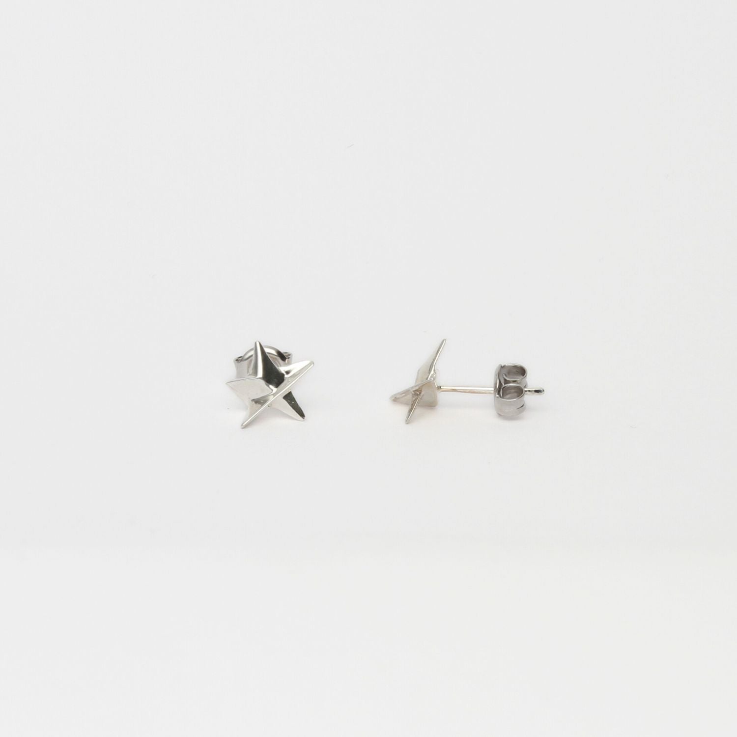 Mini silver star studs by Yuki Mitsuyasu