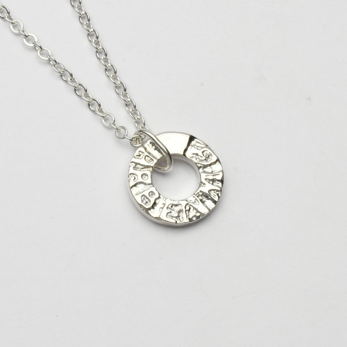 Arbennig sterling silver charm pendant, close-up of handwritten lettering