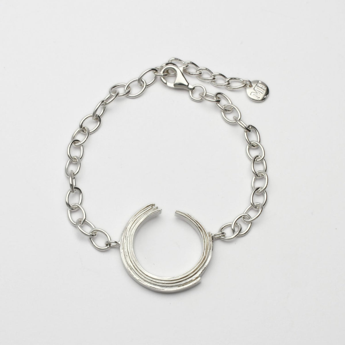 Brushstroke bracelet, sterling silver — a fluid line held close to the skin — Breichled Arian
