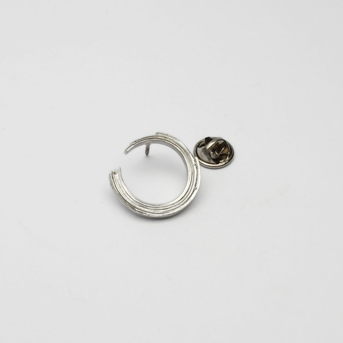 Brushstroke brooch, sterling silver — a single considered stroke of paint cast in metal