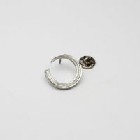 Brushstroke brooch, sterling silver — a single considered stroke of paint cast in metal
