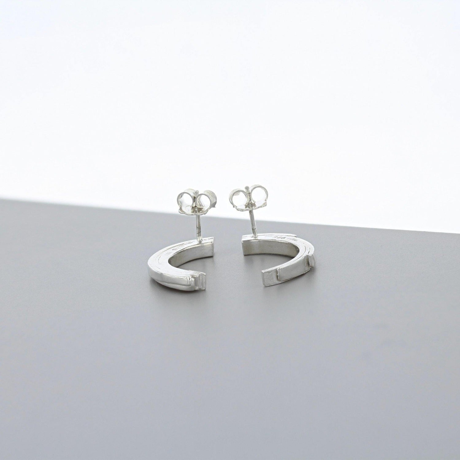 Brushstroke curved sterling silver earrings, side profile
